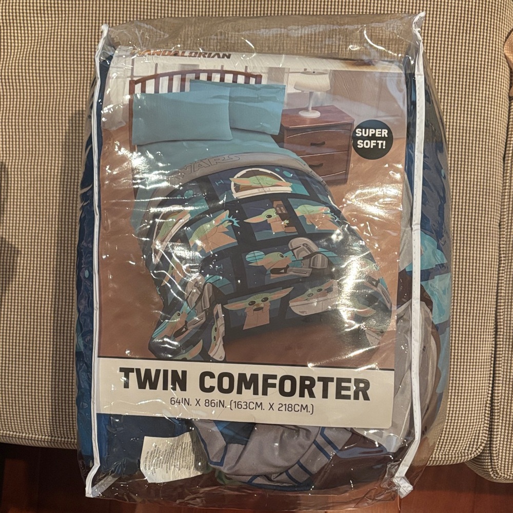 Star Wars reversible comforter - Blue print on one side, grey print on other .